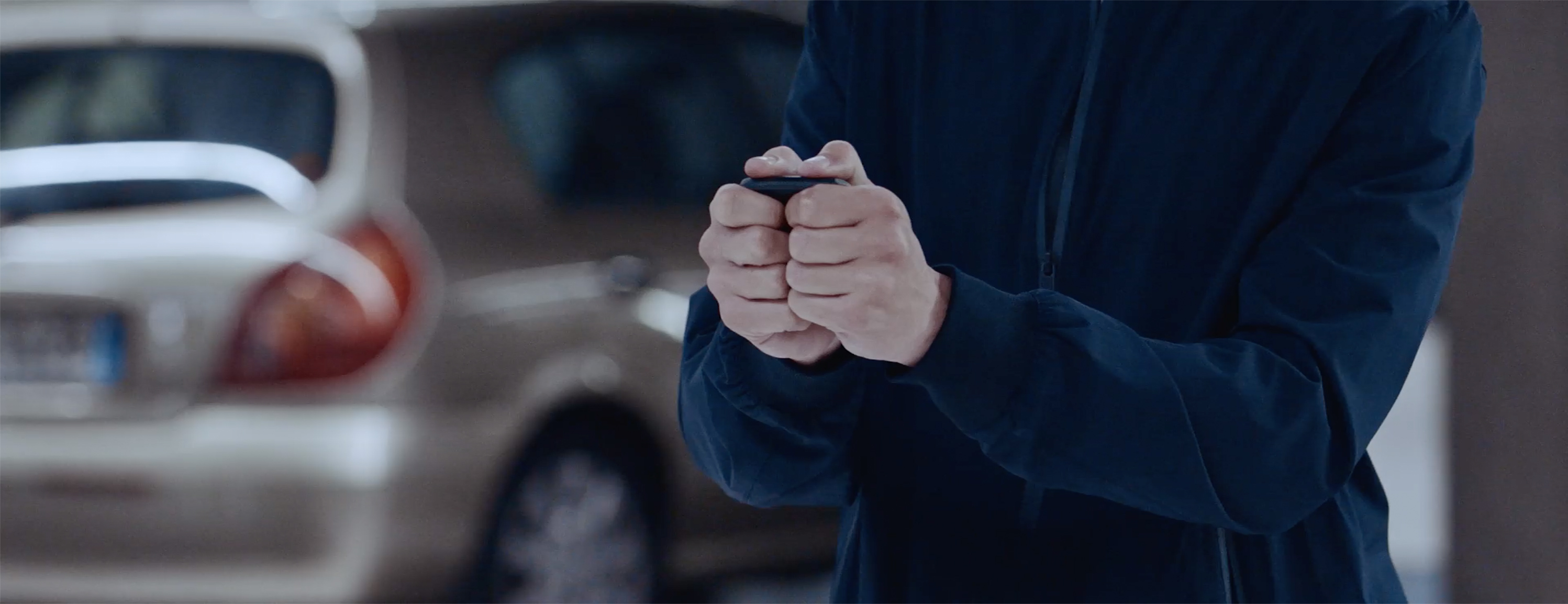 Video showing person use intelligent key for propilot autonomous parking